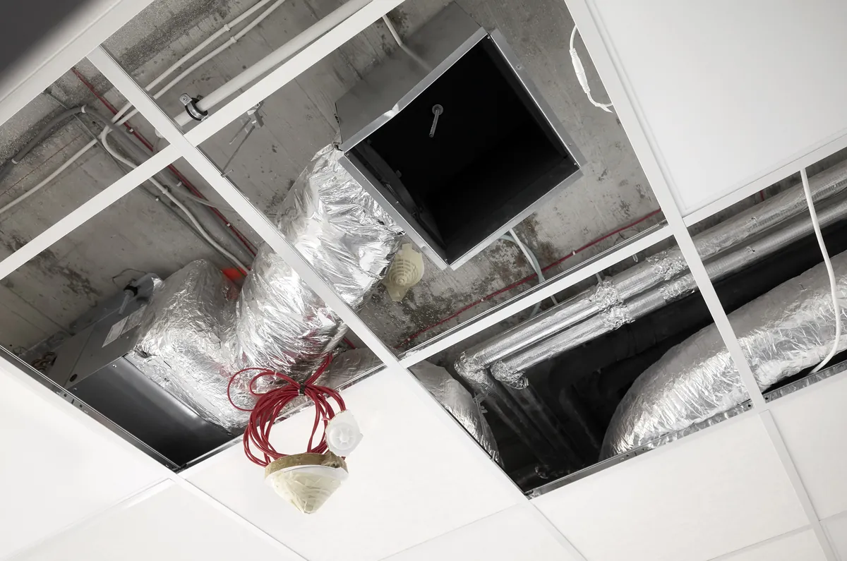 High-angle view of exposed insulated ductwork and infrastructure during a post-construction HVAC inspection in Los Angeles by SoCal Green Air and Chimney.