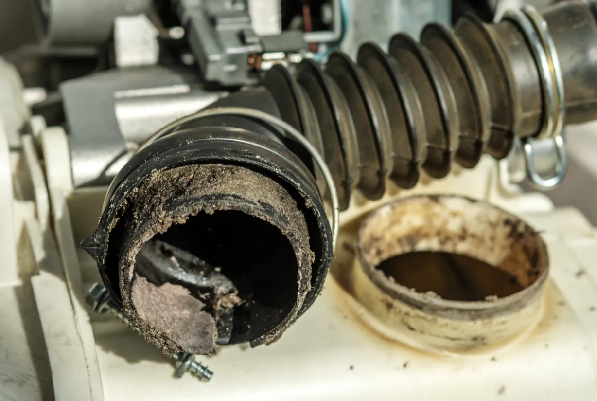 A detailed close-up of a severely clogged and dirty ventilation pipe showing heavy debris blockage that requires professional clearing in Los Angeles.